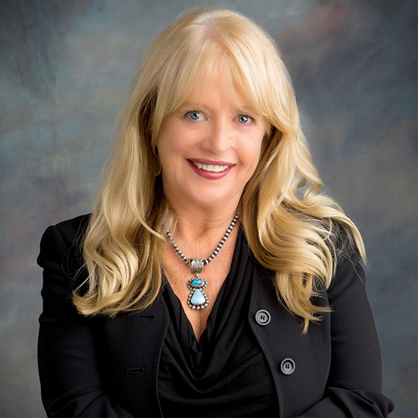 Lawyer Nancy Cronin - Blonde woman wearing a black suit with turquoise and silver jewelry